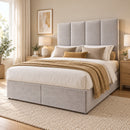 Dover upholstered divan storage bed and headboard in a modern bedroom, three-quarter view