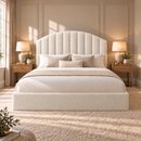 The Harrington cream upholstered bed side angle with luxury arched headboard