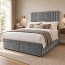 Hatford grey upholstered divan storage bed with panelled headboard in a modern bedroom, three-quarter view