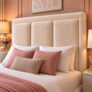 Close-up of Mona's three padded headboard panels and upholstered border
